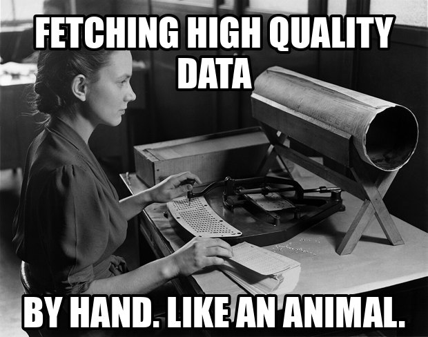 A woman operating a punch card machine