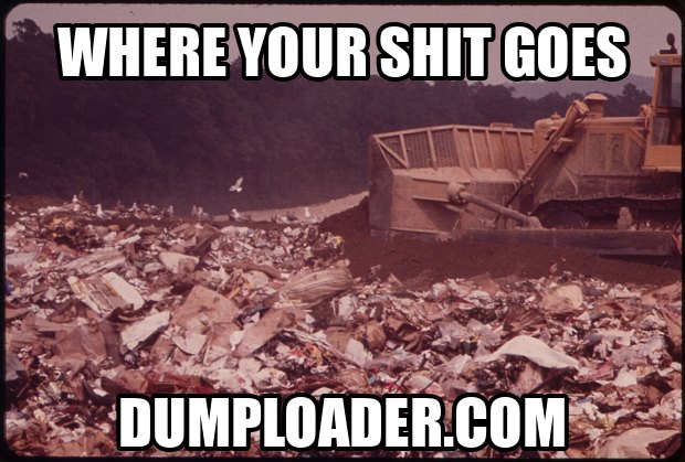 A bulldozer covering a landfill