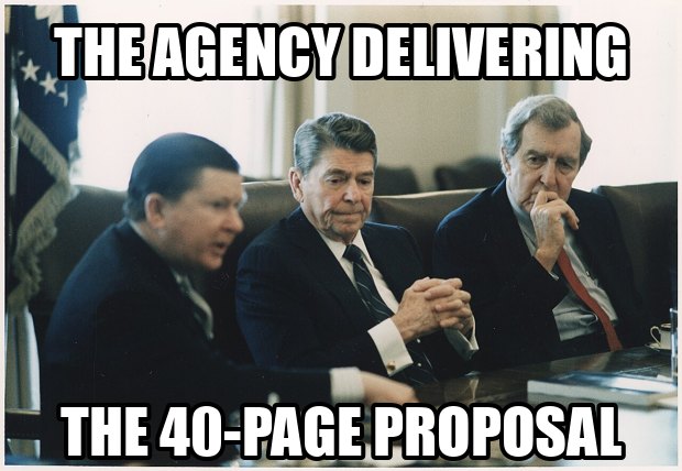 Men at a conference table receiving a thick report